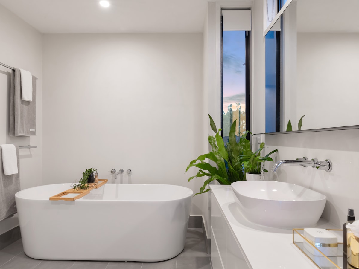 Stone bathroom with a rain shower and natural light