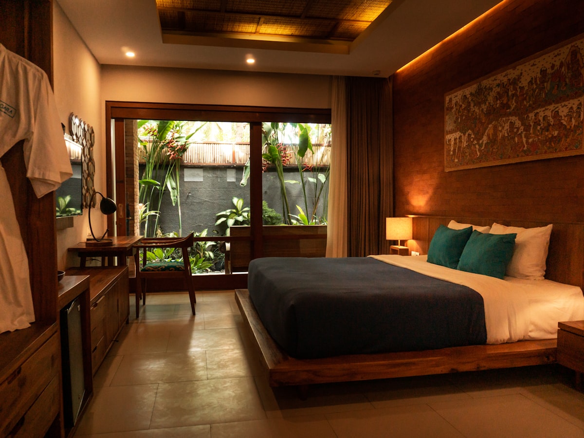 Master bedroom with a king bed and garden view
