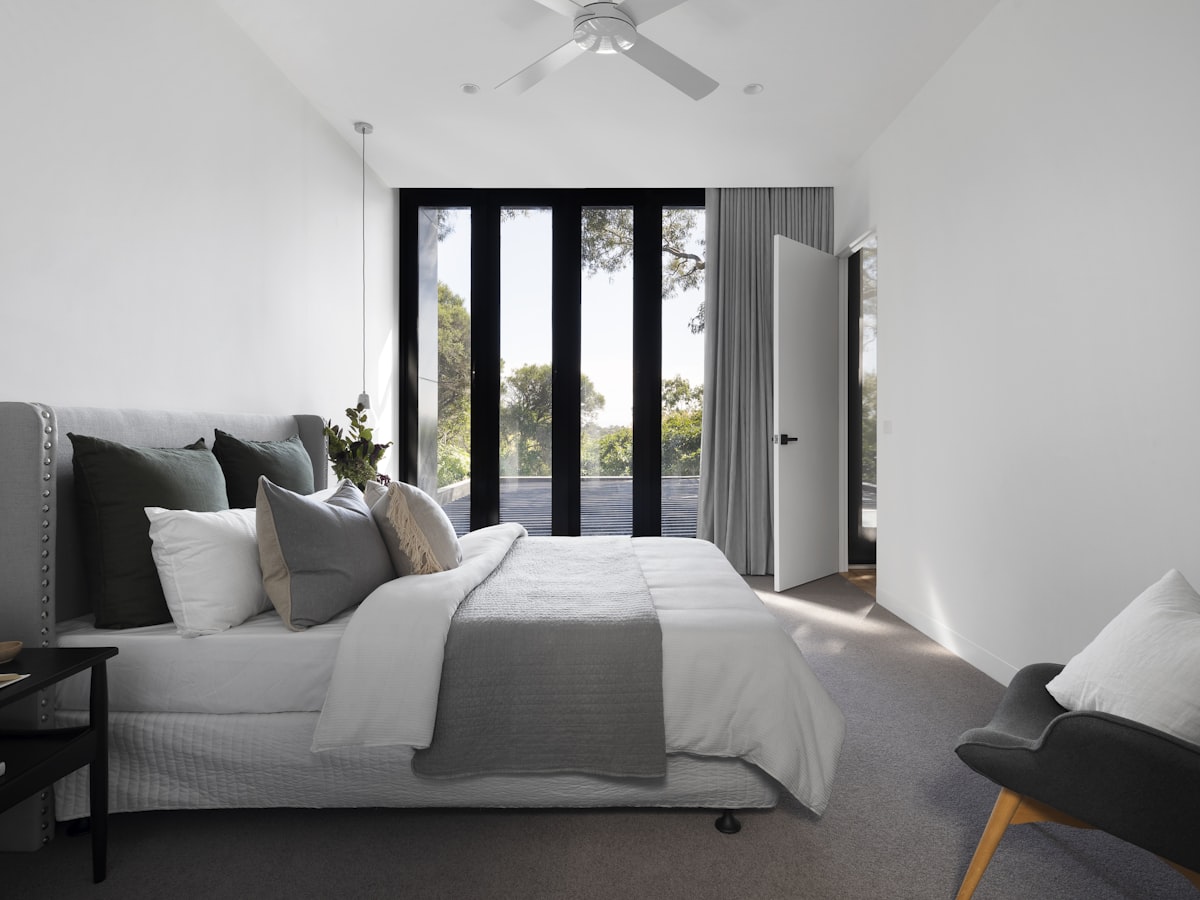 Second bedroom with twin beds and warm wooden accents
