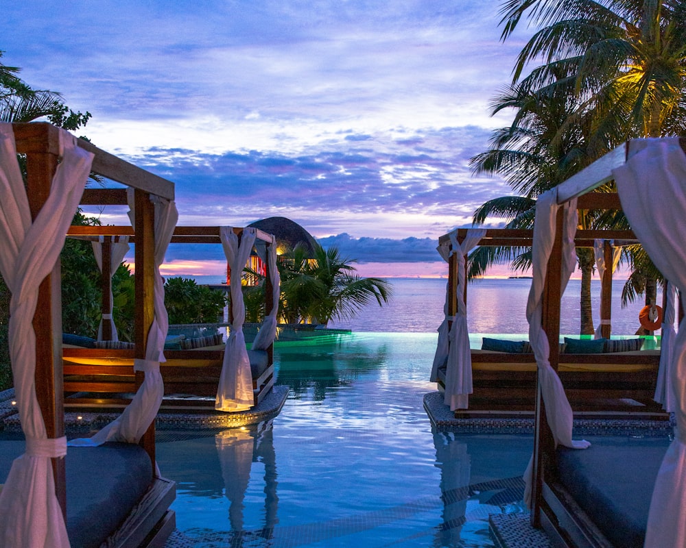 Poolside daybeds at dusk